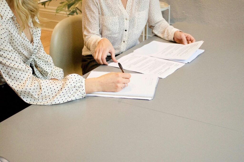 Two women reviewing some documents