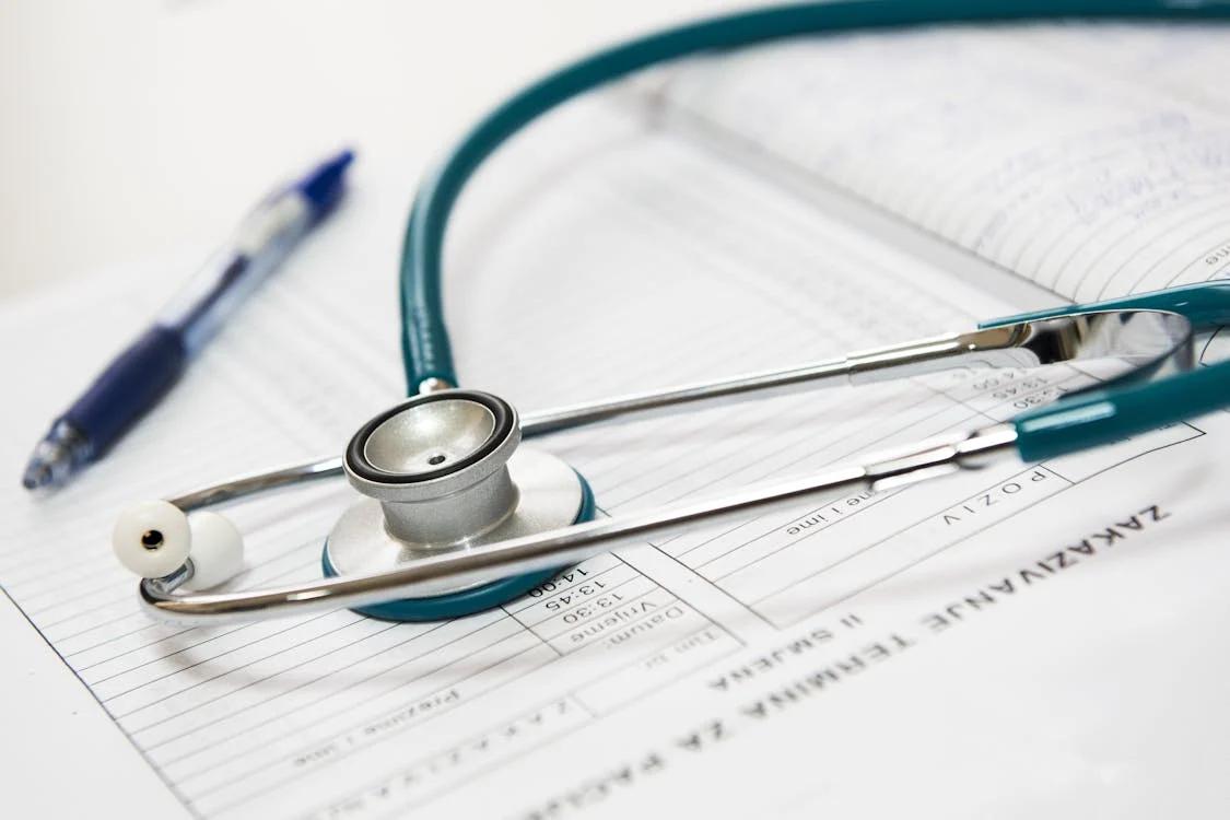 A blue stethoscope on a  doctor's register