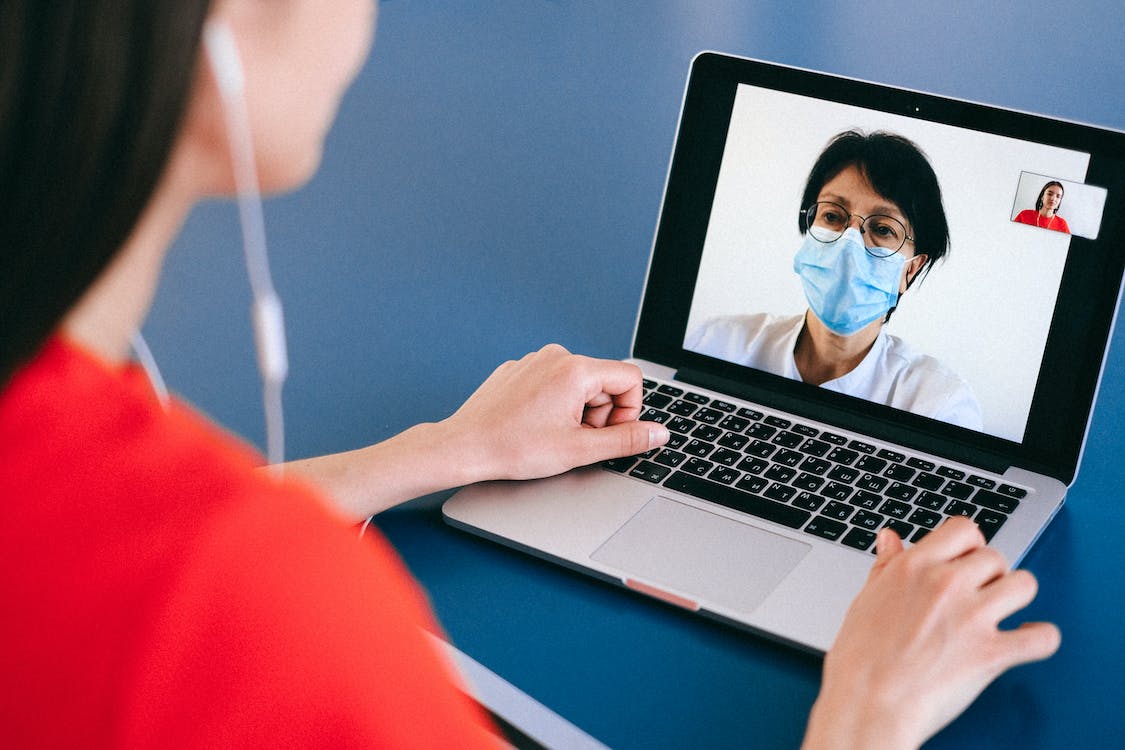  A woman on a video call with a doctor