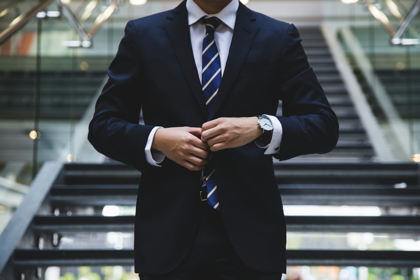 A person putting on a suit before getting an online doctor’s note for school