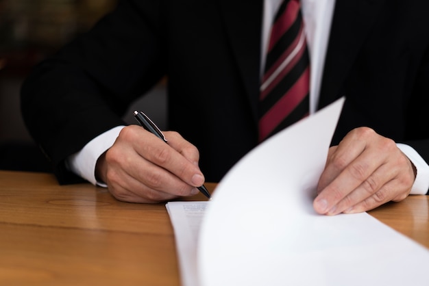 Man signing an official document 