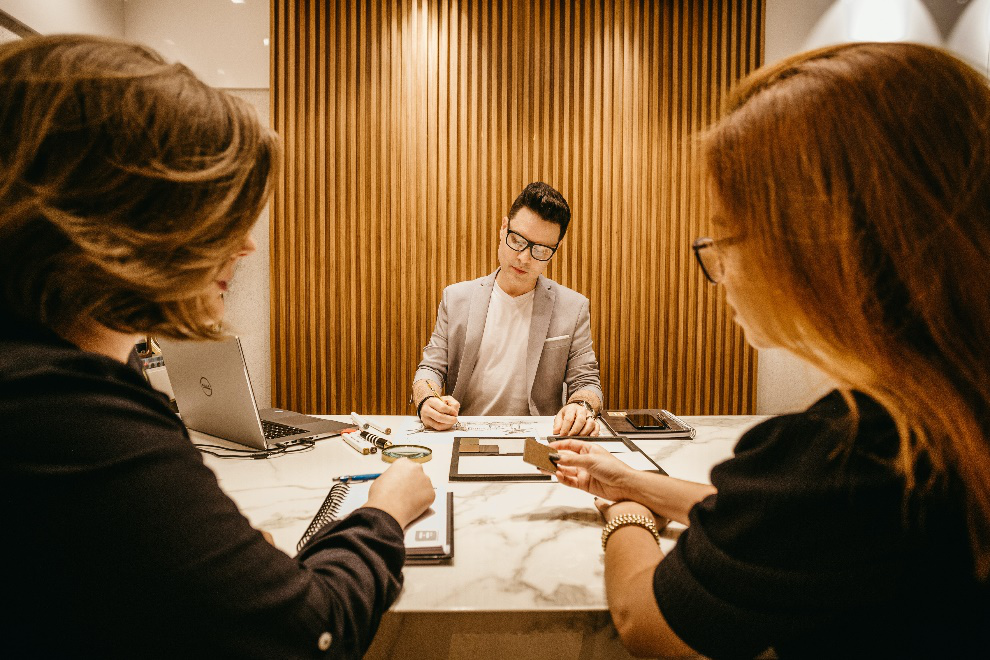 Trio of people in a meeting