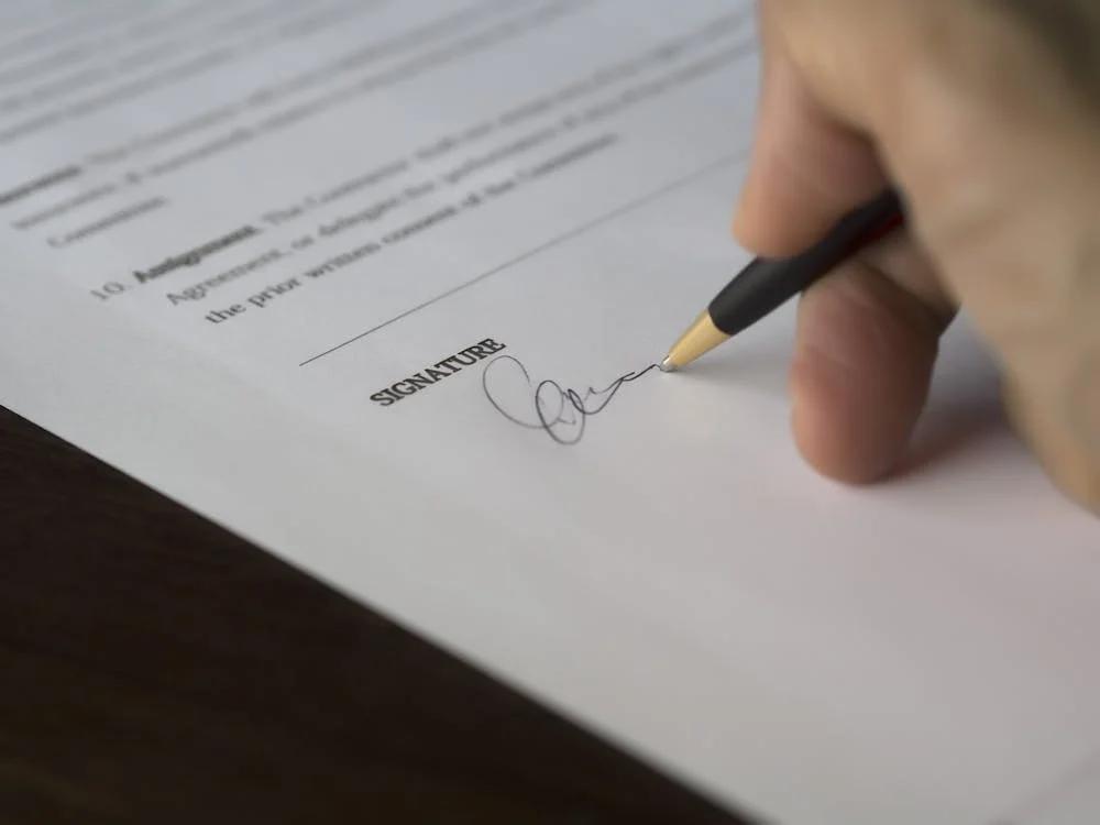 A person signing a consent form