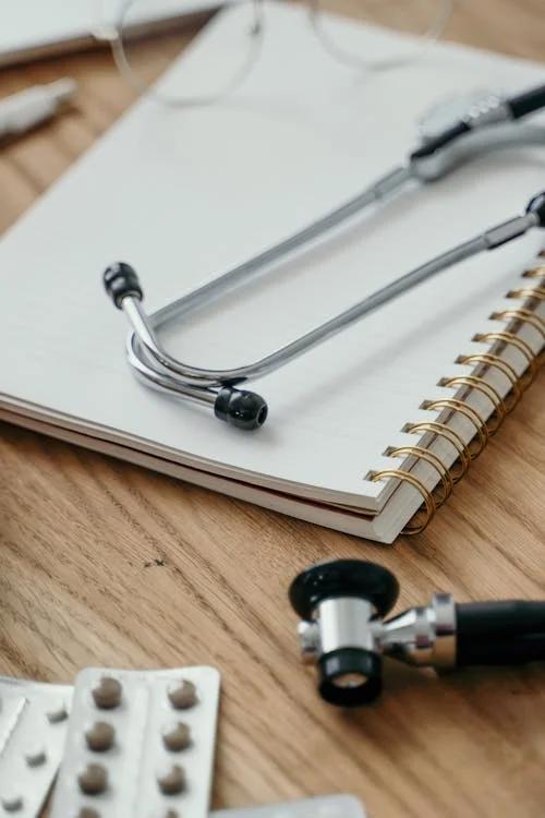 A close-up image of a doctor's prescription sheet with a stethoscope.