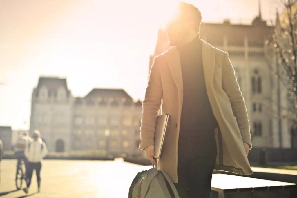 A man wearing a brown coat