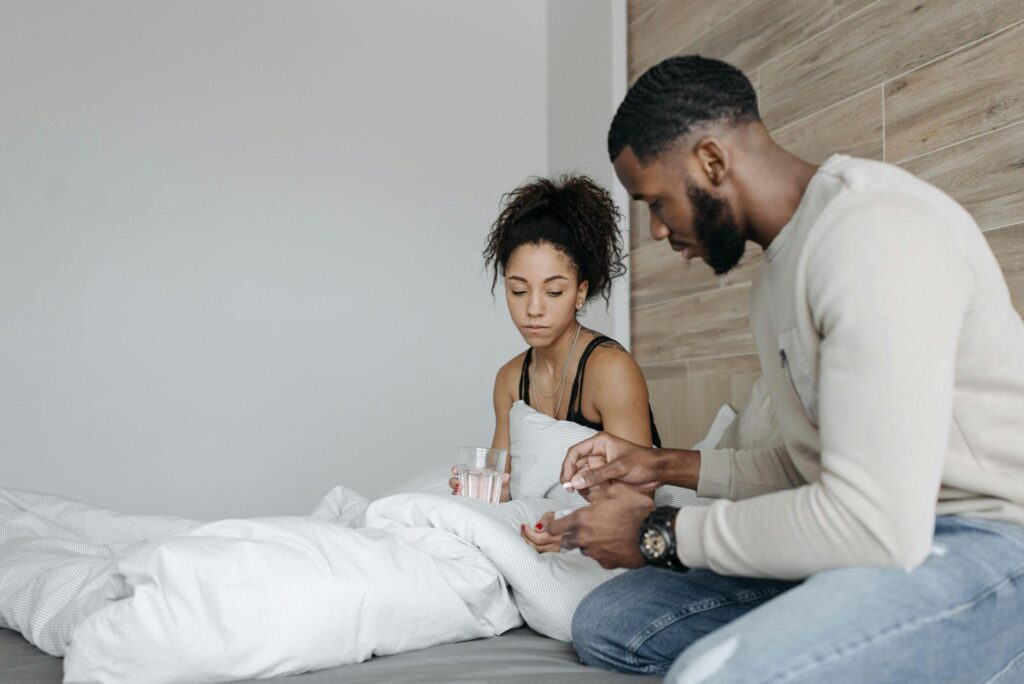 A man taking care of his sick wife.