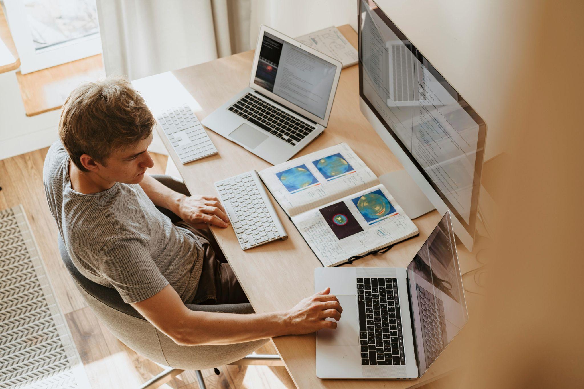 A man is working at his desk