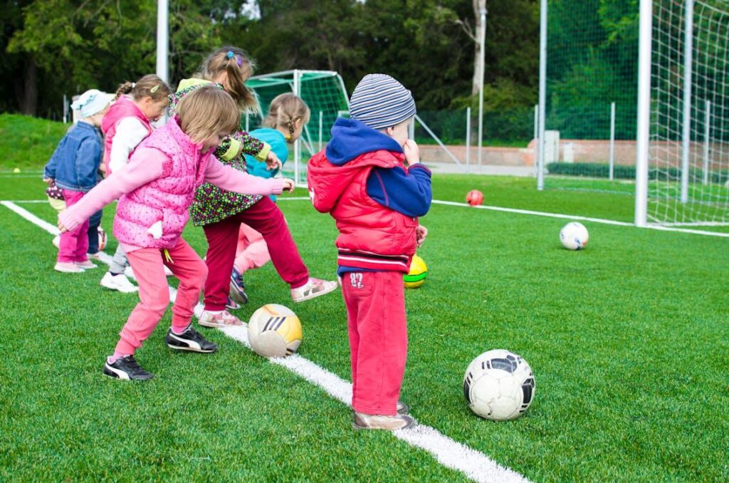 Children playing sports while dressed in winter wear