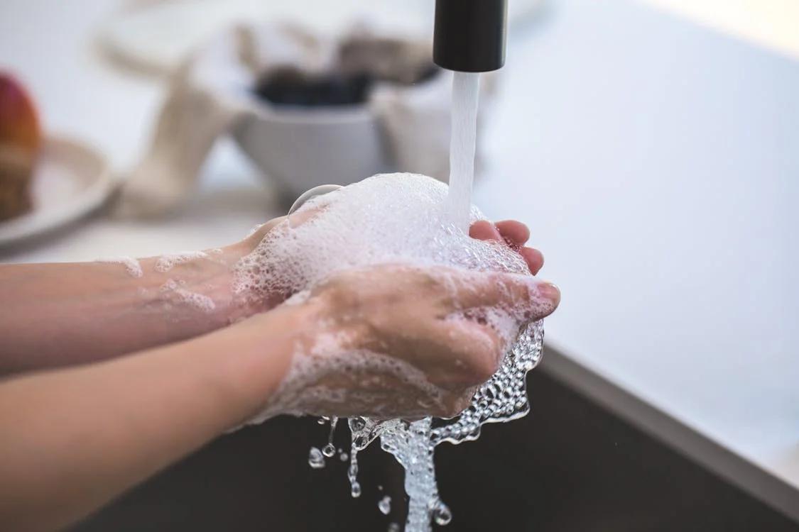 A person washing hands