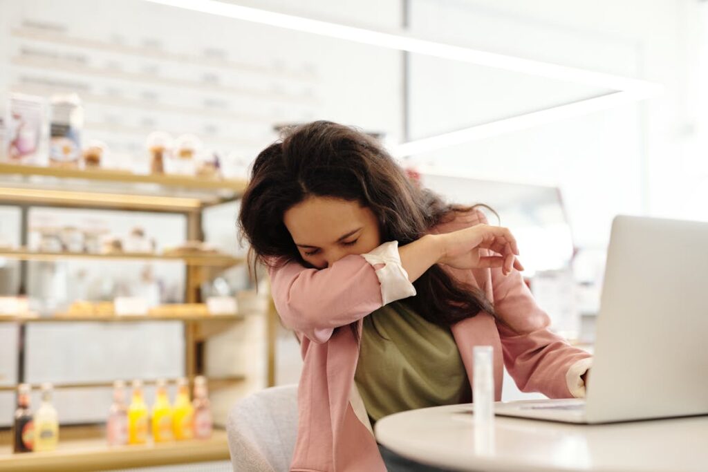 a woman sneezing