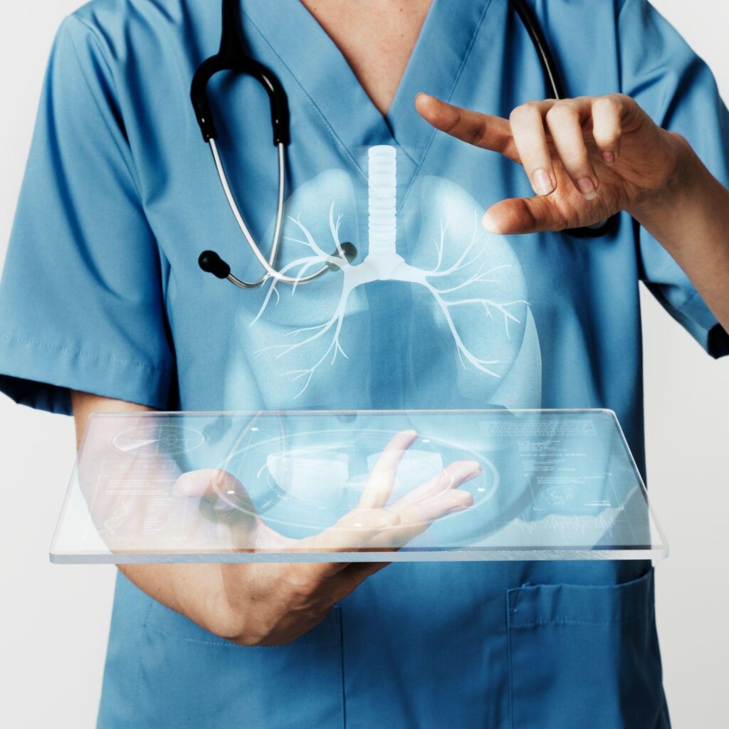 A doctor using a holographic display to demonstrate the lungs