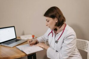 A doctor writing a note. 