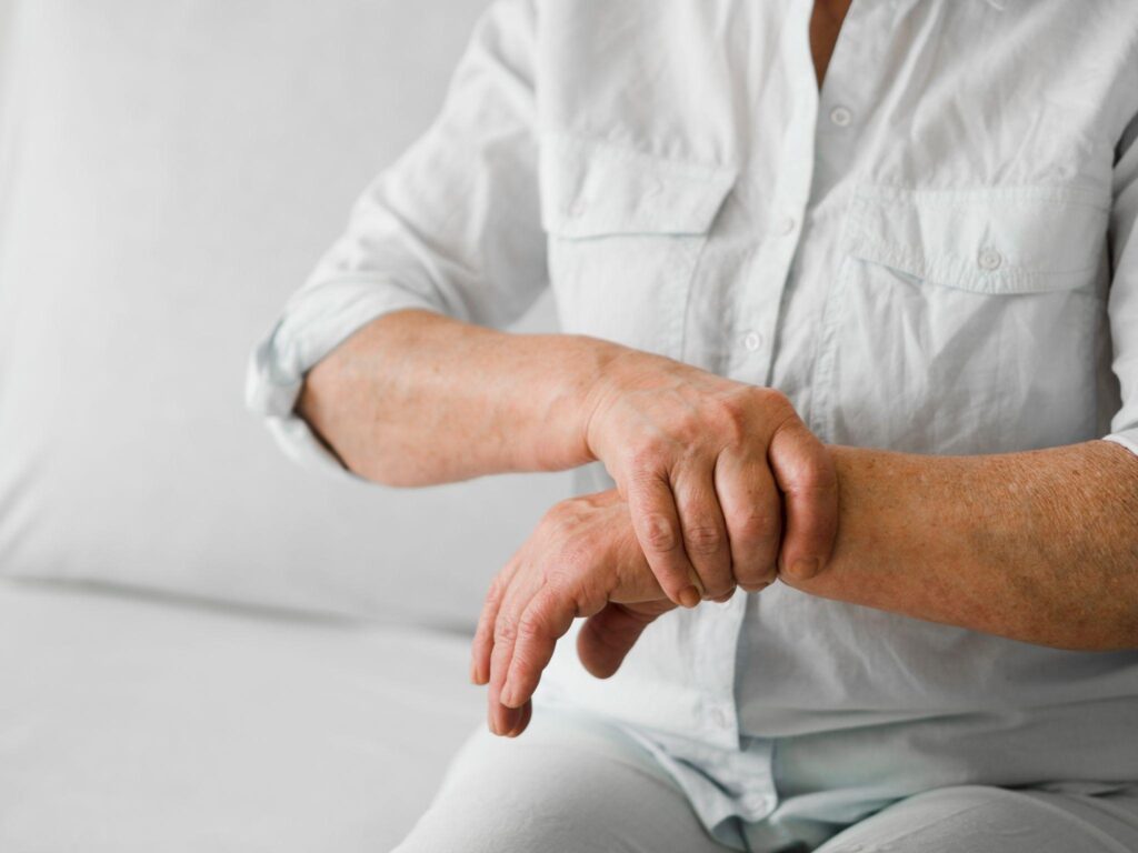 Person holding his wrist in pain