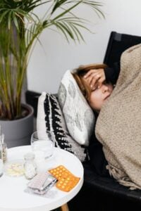 Ill woman on a sofa