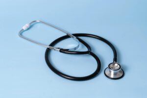 Stethoscope placed on a light blue background