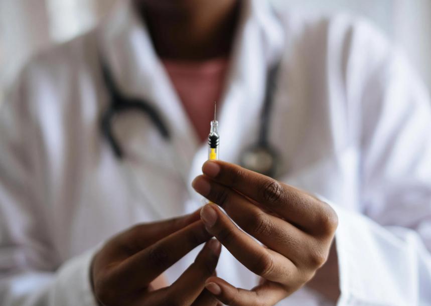 A doctor administering a vaccine.