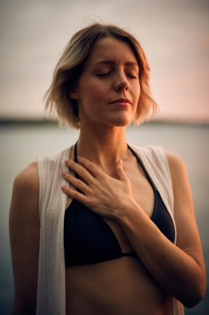 a woman taking a deep breath.
