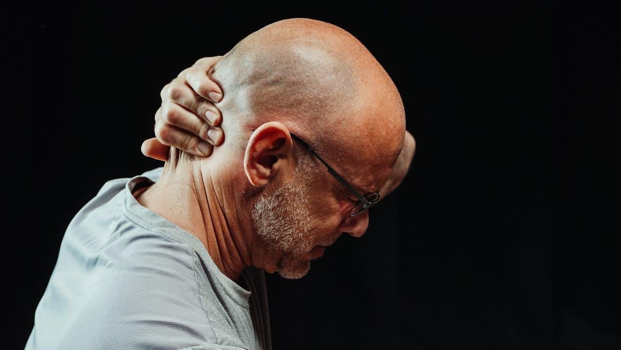 A man suffering from neck pain