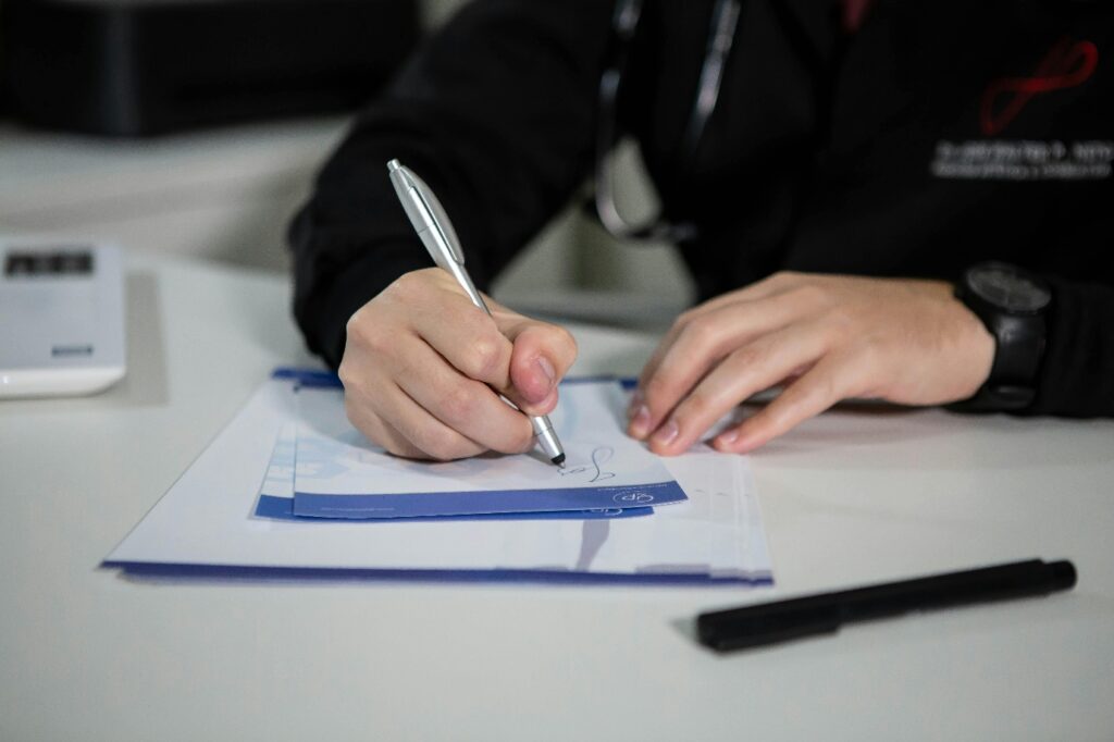 a person writing a note