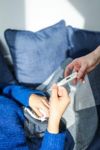 Person appearing ill with flu symptoms