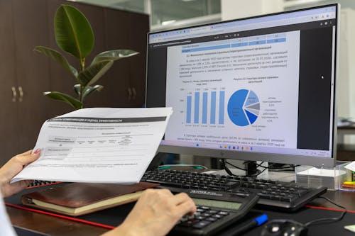 a person looking at data on the computer