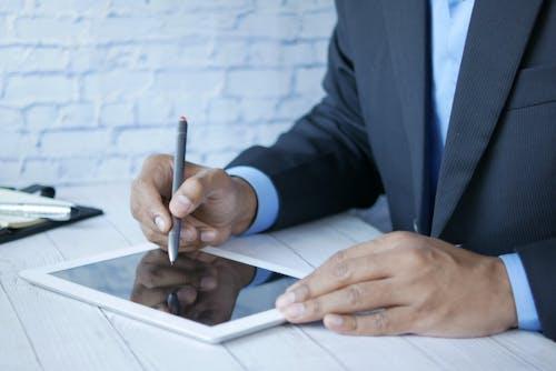 A man signing electronically
