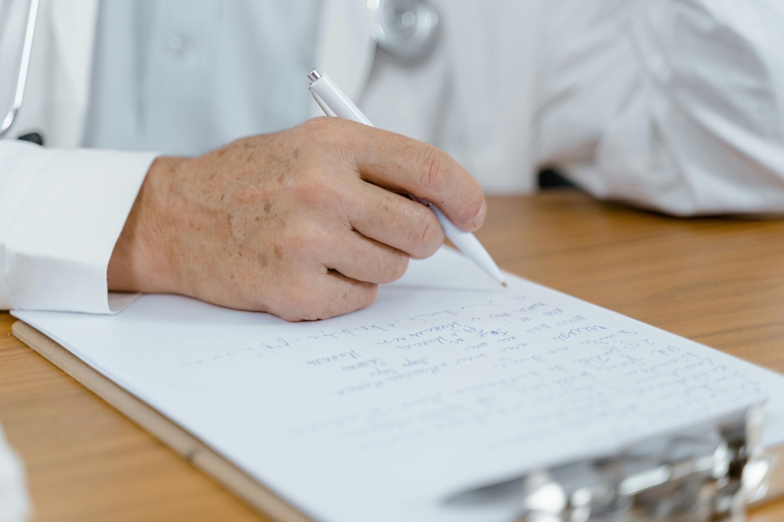 a doctor writing a leave certificate for a patient
