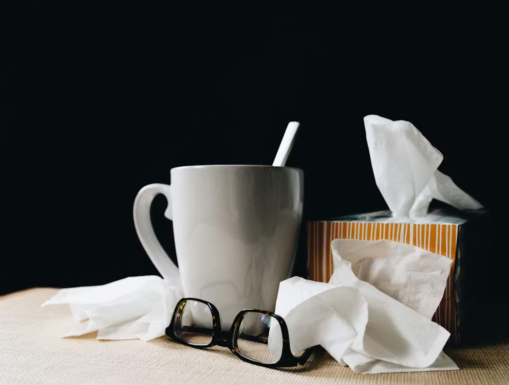 A mug and box of tissues 