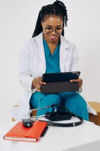 a doctor holding a tablet.