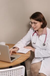 a doctor using a laptop.