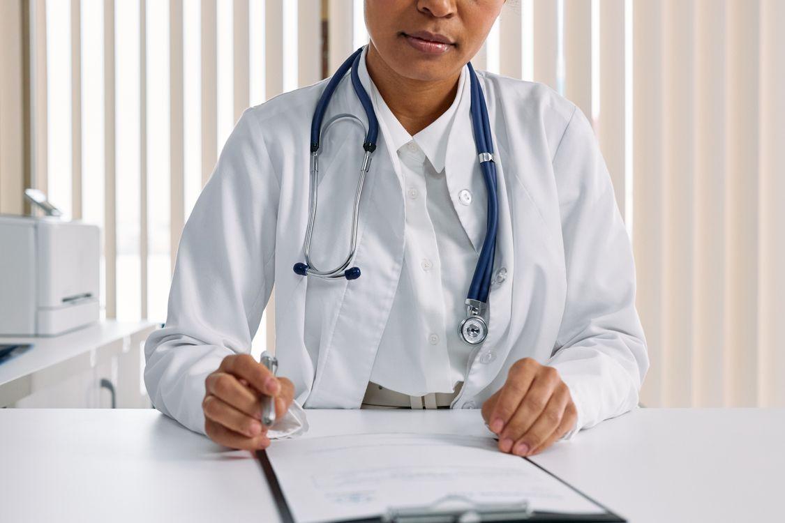 a doctor writing a sick note.