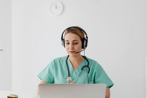 a doctor talking to a patient online.