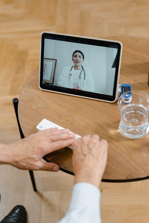 a doctor using a tablet.