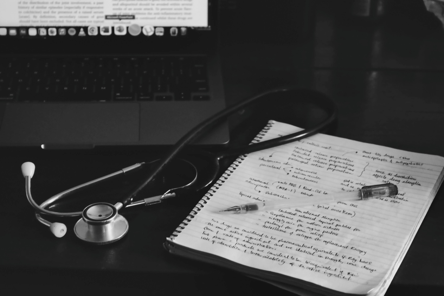 A doctor’s notes next to a stethoscope