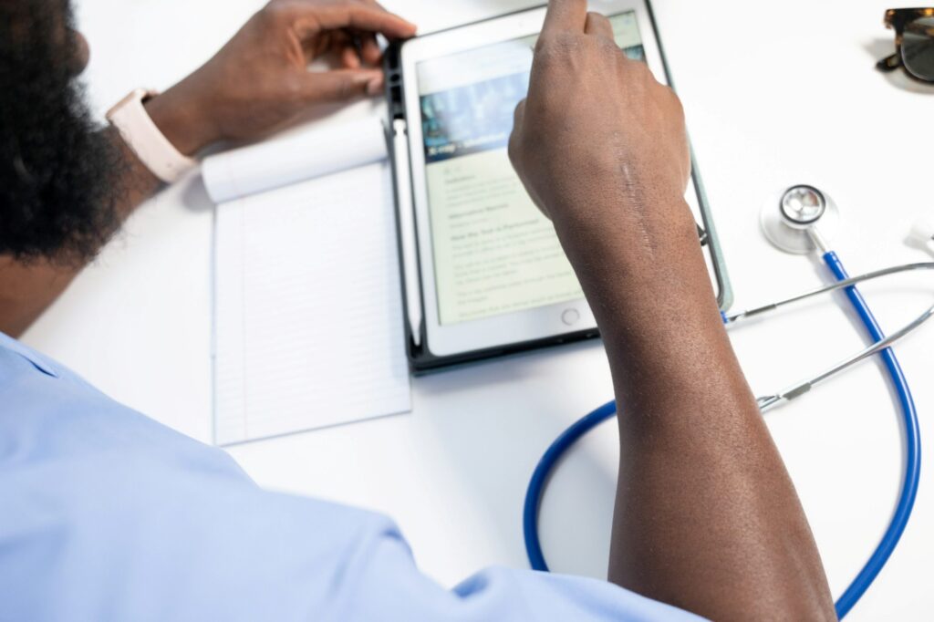 A doctor using a tablet