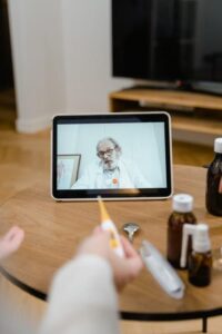 A person taking an online consultation with a doctor.