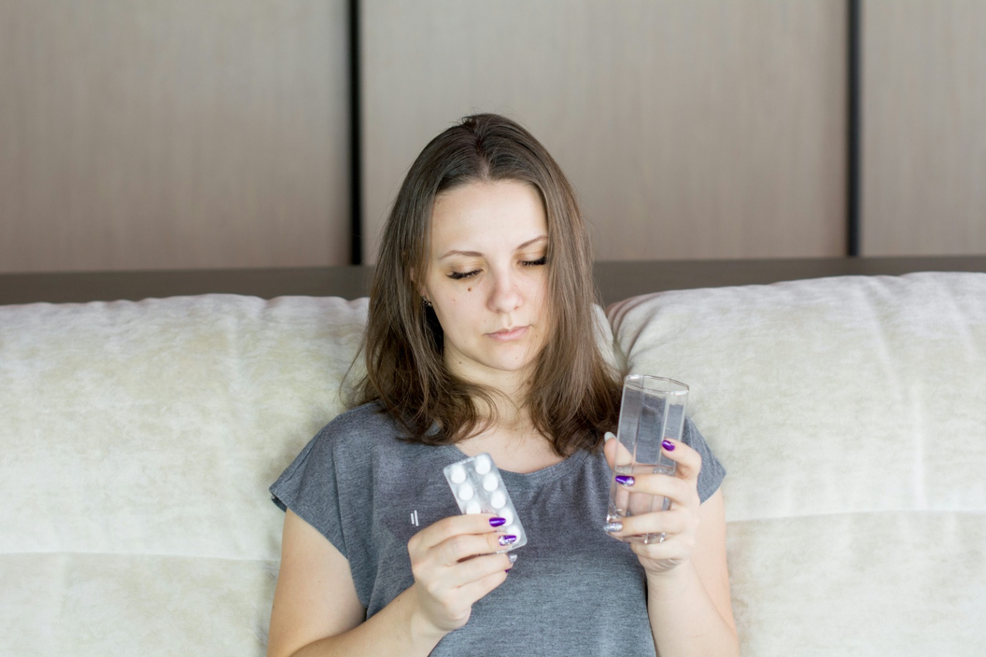 A woman taking medicine