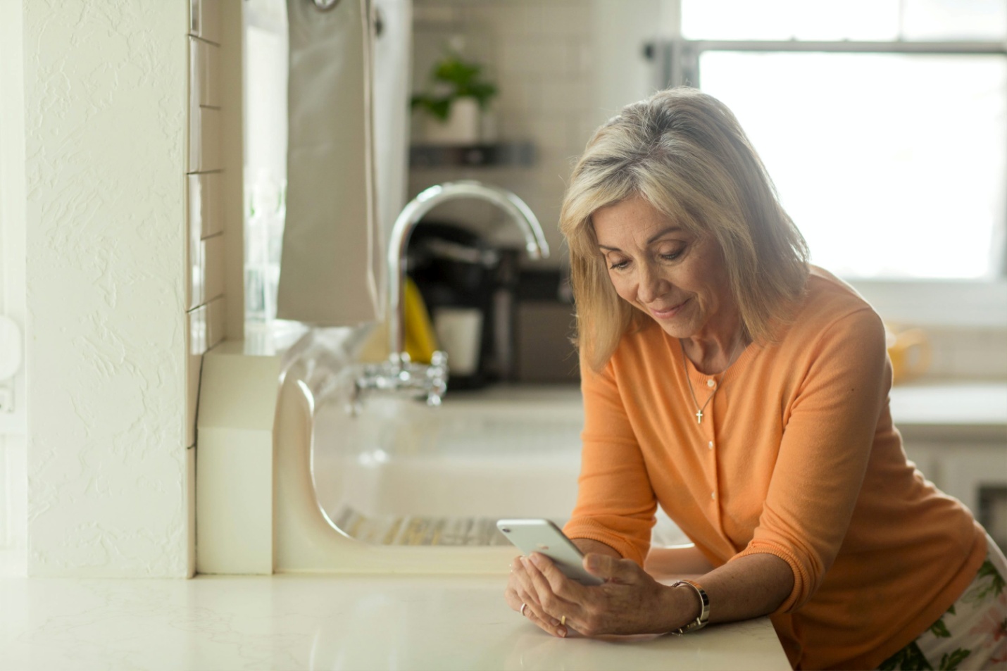 A woman looking at her phone